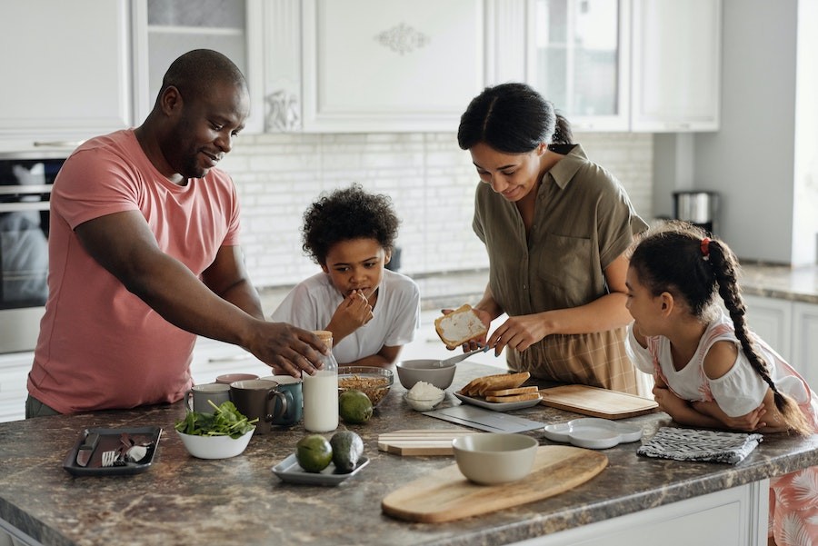 A family cooking together in their kitchen.