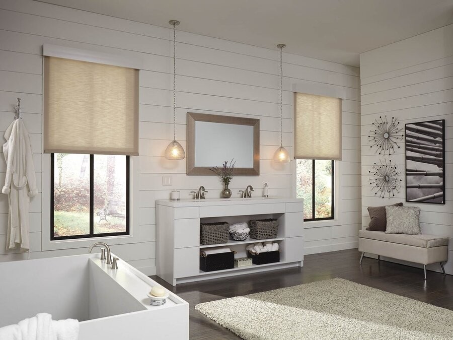 A light, contemporary rustic bathroom with motorized shades on the windows.